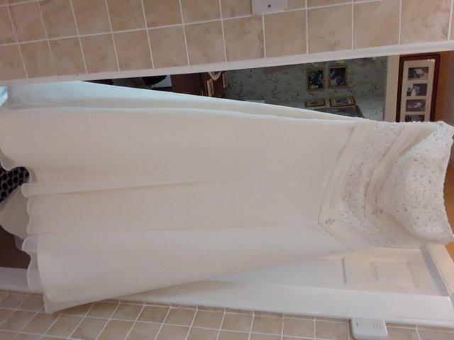 Preview of the first image of Ivory Wedding Dress by Ellis size 16.