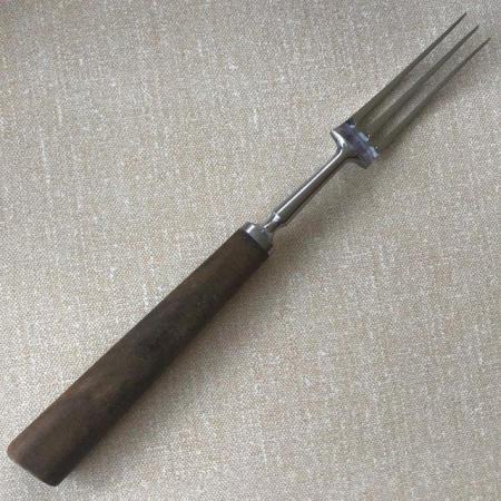 Image 1 of Vintage meat fork, stainless steel + wooden handle.