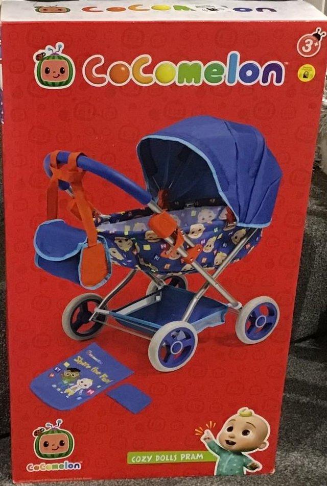 Preview of the first image of NEW Cocomelon Doll's Pram, Unused in box..