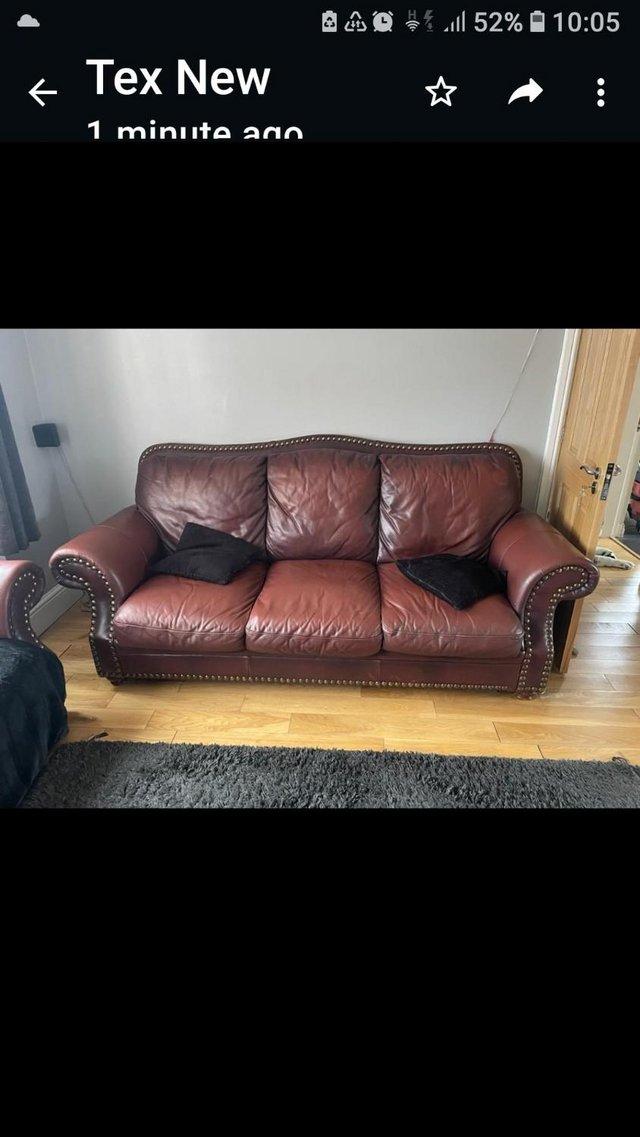 Preview of the first image of Thick leather Tan 3 seater sofa.