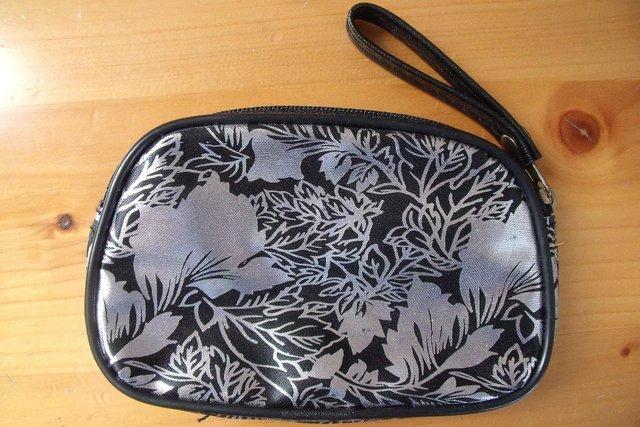 Preview of the first image of NEW silver metallic/black leaf design coin purse..