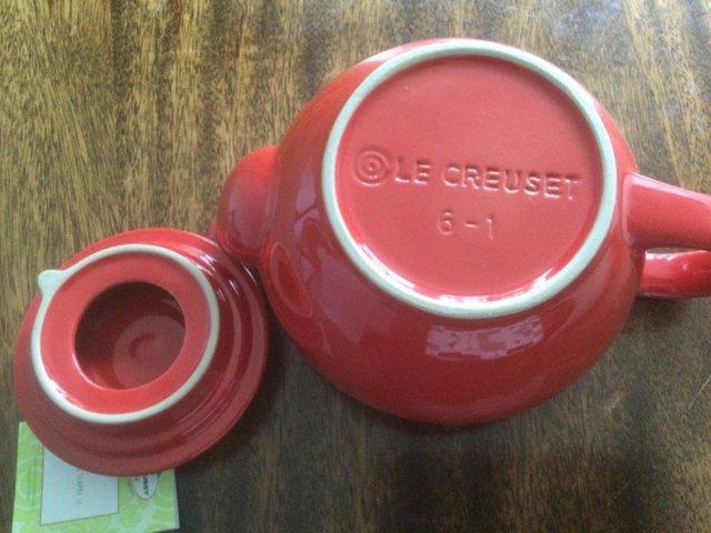 Preview of the first image of Le Creuset classic red teapot brand new..