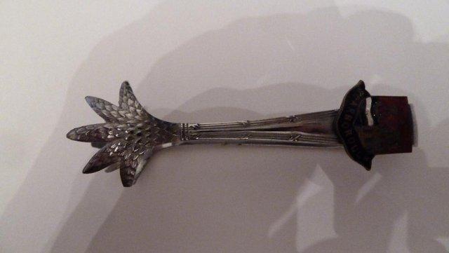 Preview of the first image of sugar tongs Chrome plated .Crows feet design.