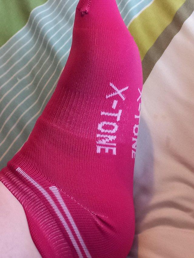 Preview of the first image of Worn ladies xtone pink socks.