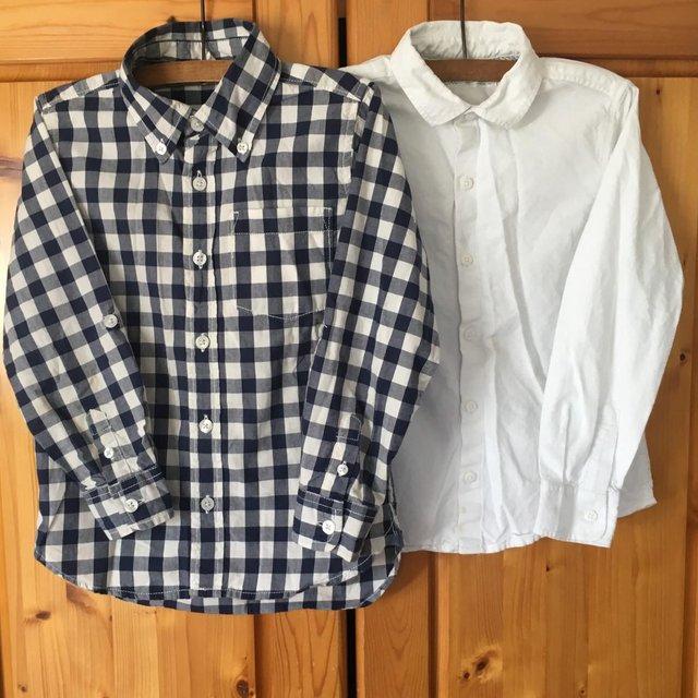 Preview of the first image of 2 l/sleeve shirts age 5 yrs GAP & 5-6 yrs next. £1.50 both..