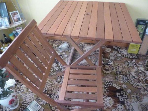 Image 1 of Hardwood Indoor or Outdoor Table and Chairs.