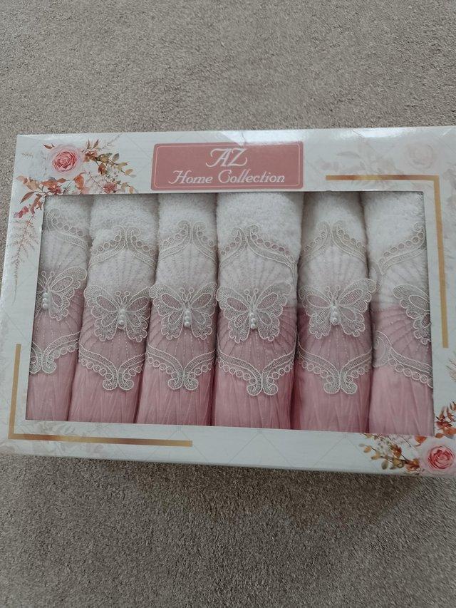 Preview of the first image of Towels boxed hand towels pink and cream.