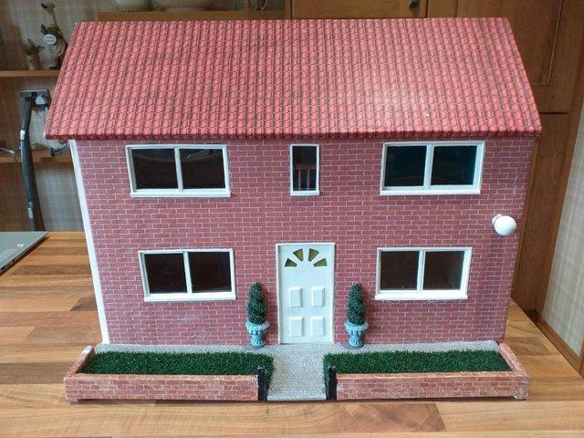 Preview of the first image of childs doll house 17inches h,14 inches w, 22inches long.