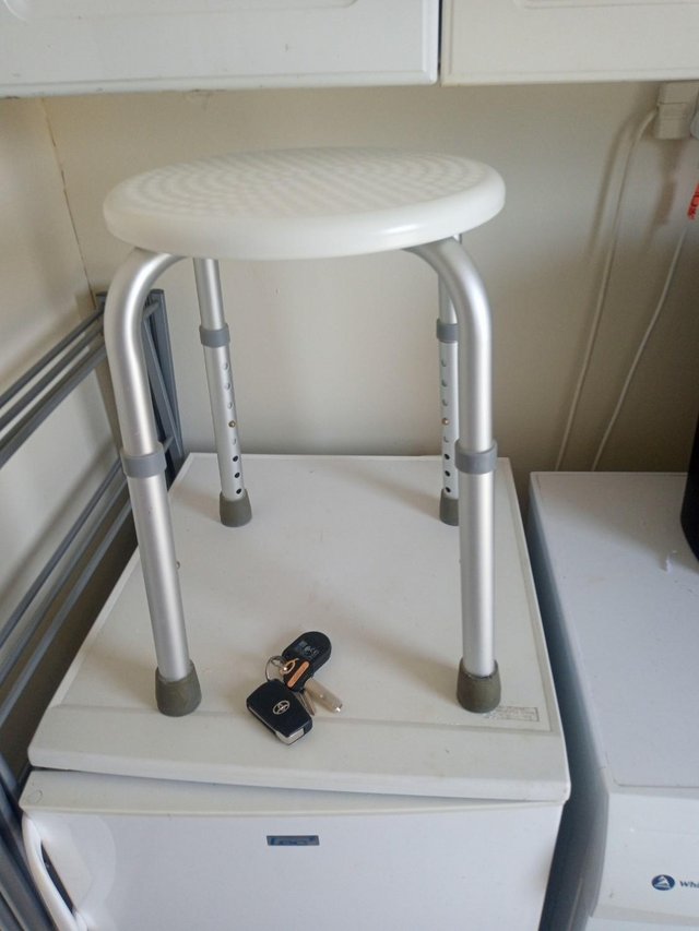 Preview of the first image of shower stool adjustable legs.