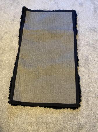 Image 2 of Dark blue rug for sale .