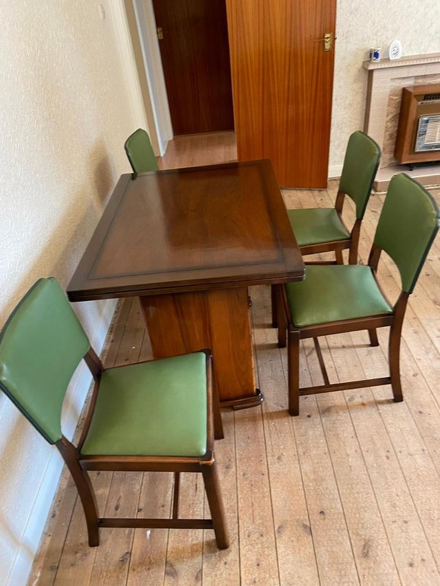 Preview of the first image of 1950s extendable Dining Table and four matching chairs.