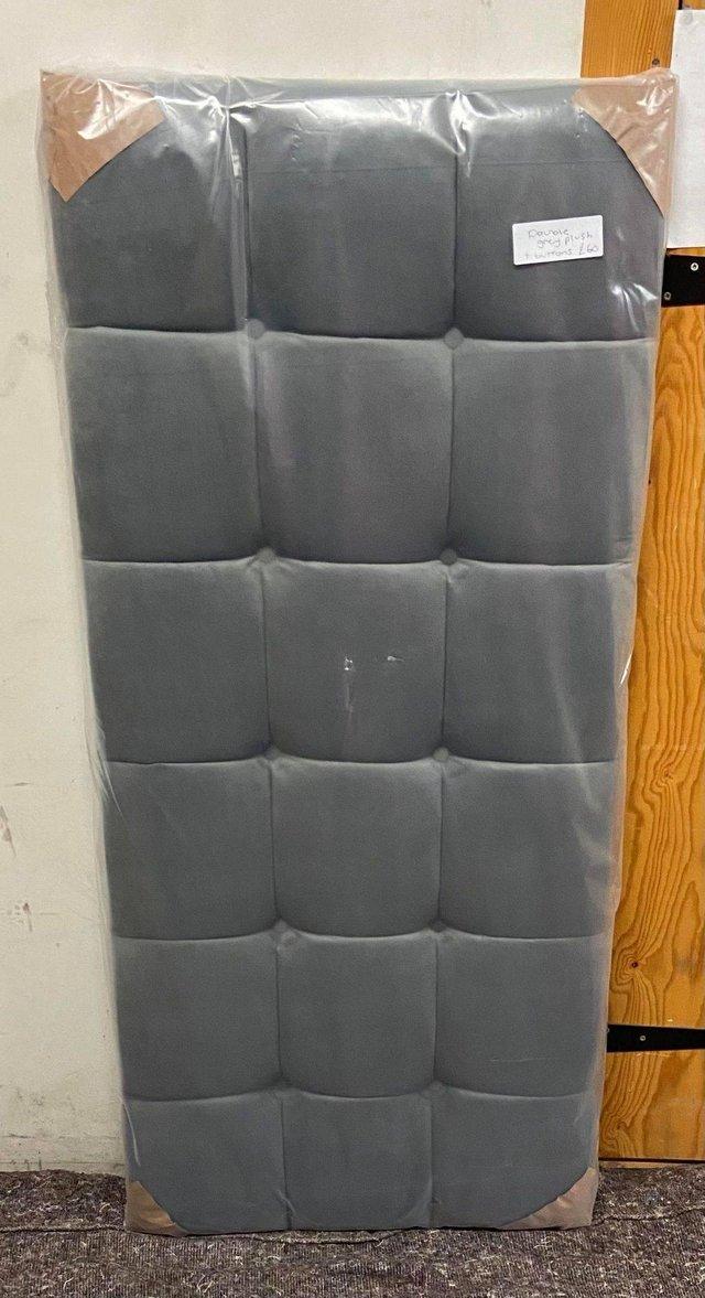 Preview of the first image of DOUBLE GREY PLUSH + BUTTONS HEADBOARD.