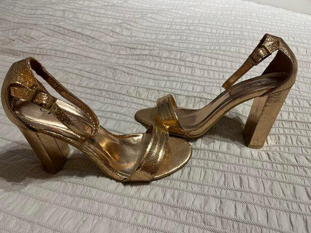 Preview of the first image of Gold 2 part block heel sandals size 5.