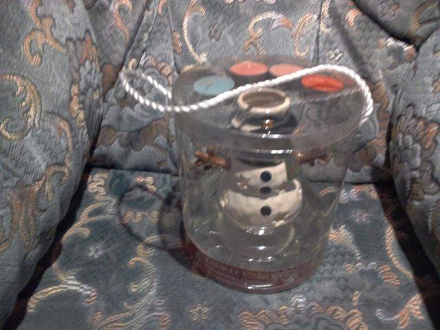 Preview of the first image of YANKEE CANDLE SNOWMAN TEALIGHT HOLDER NEVER USED.