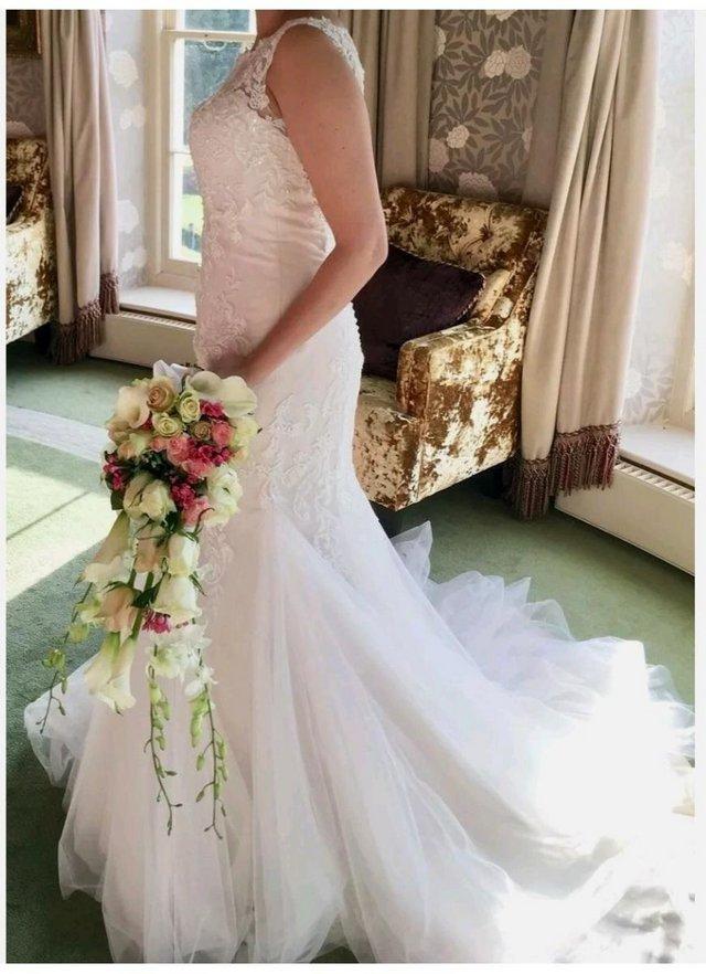 Preview of the first image of Mermaid Sleeveless Wedding dress, Ivory Blush, Size 10.