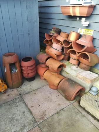 Image 2 of Assortment of chimney pots, cows etc poss del/fit?.