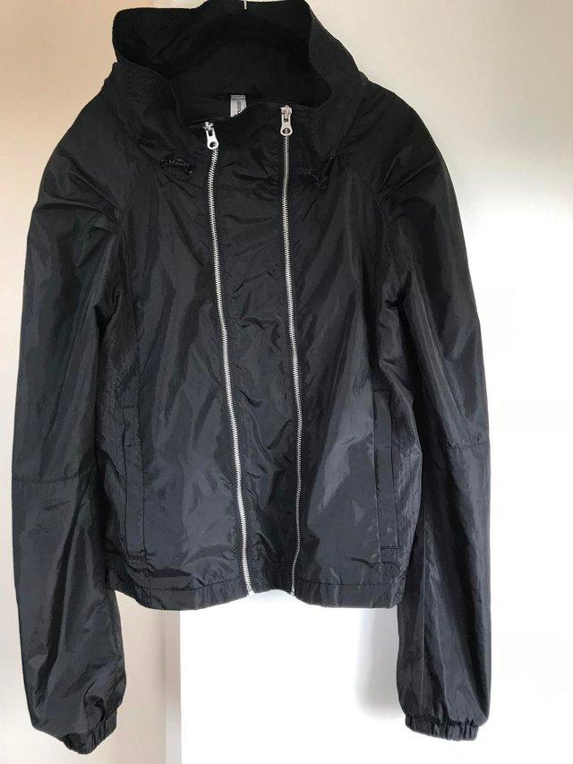 Preview of the first image of Lorna Jane Black Windproof & Showerproof Bomber Jacket - S.
