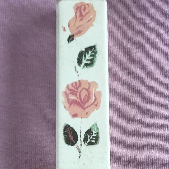 Preview of the first image of Vintage 1960's pink rose travel toothbrush container.
