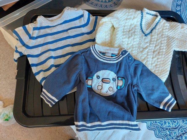 Preview of the first image of 3 baby boys jumpers aged 0-3 months.