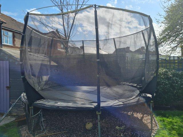 Preview of the first image of 12 ft trampoline with ladder.