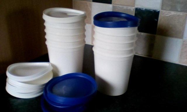 Preview of the first image of 5 White Storage PLASTIC POTS with soft flexible lids.