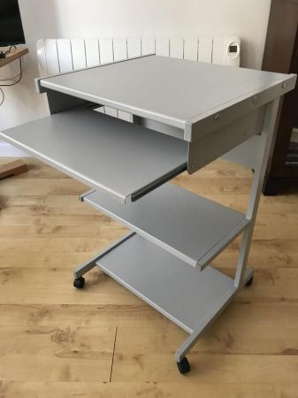 Image 2 of Grey metal computer desk unit with storage shelves.