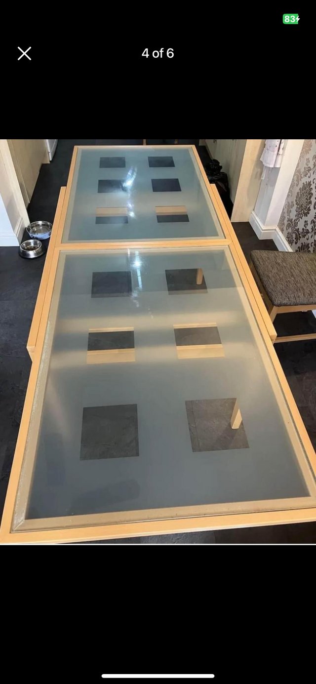 Preview of the first image of Extending dining table with glass top.