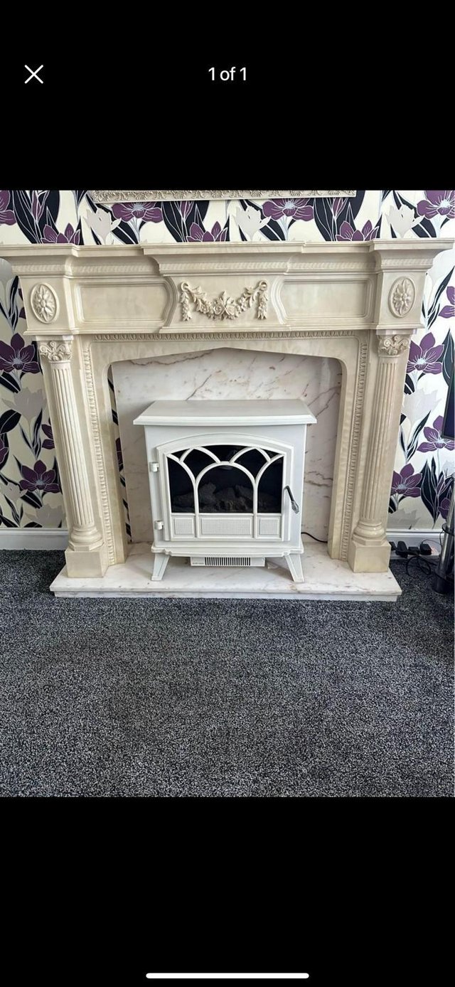 Preview of the first image of Fireplace Surround with Hearth, Backing and Electric Fire.