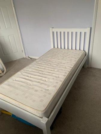 Image 1 of Single white wooden bed frame.