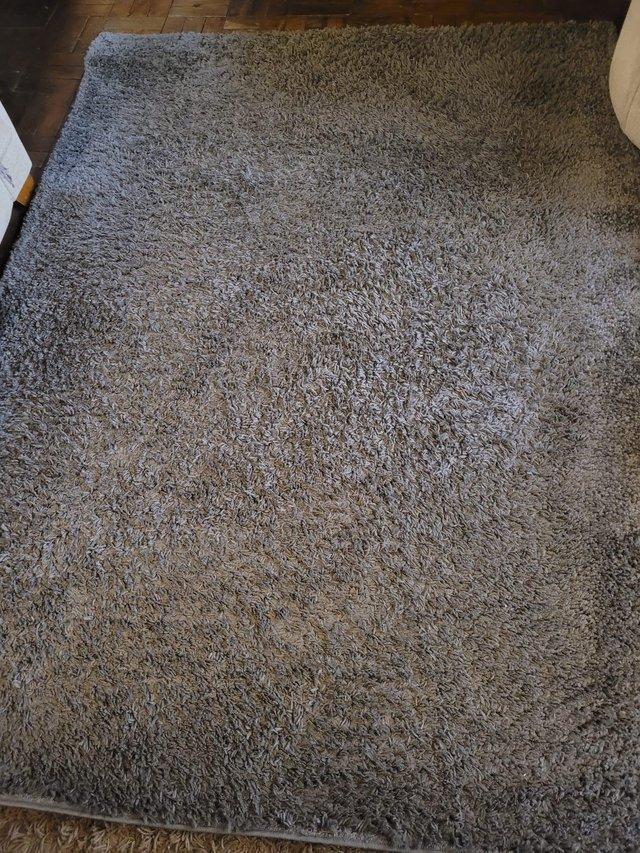 Preview of the first image of Charcoal grey rug.Excellent condition.