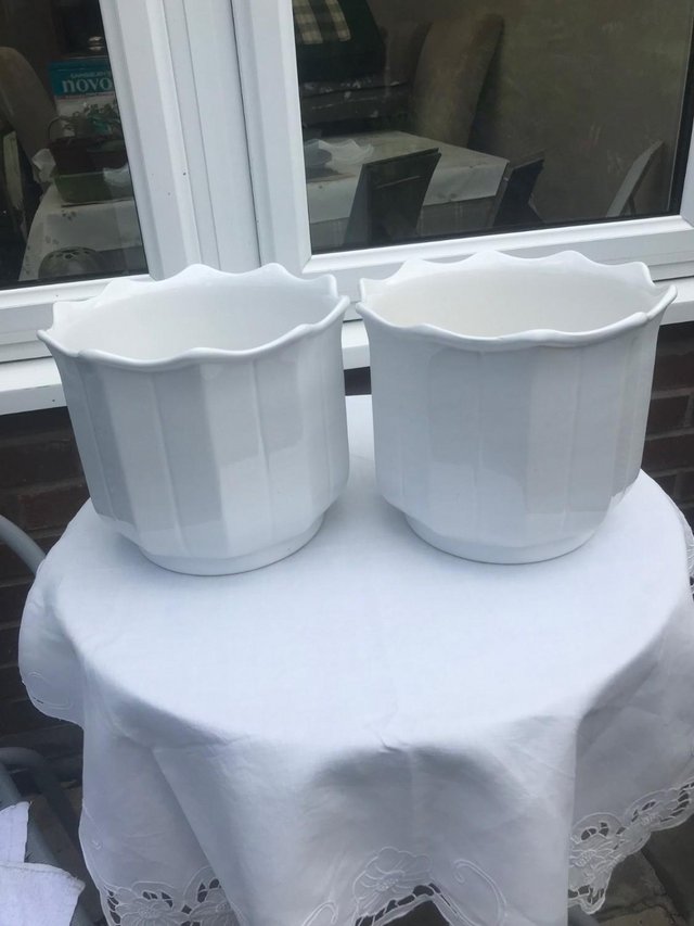 Preview of the first image of Pair of large white ceramic planters.