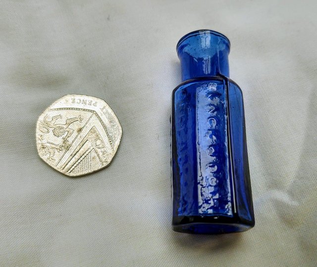 Preview of the first image of Miniature Cobalt Blue Poison Bottle.