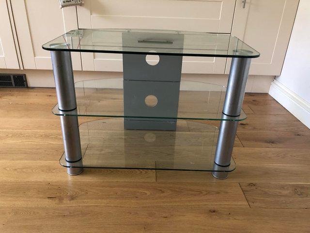 Preview of the first image of FREE Glass and chrome tv stand.