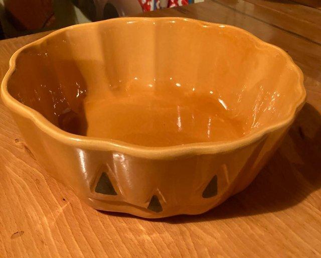 Preview of the first image of Burnt orange ceramic pumpkin pie bowl.