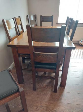 Image 3 of Solid wood.extending dining table and 8 chairs