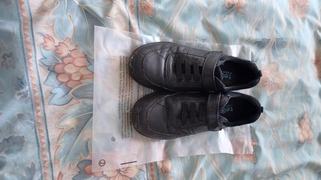 Preview of the first image of Boys Term Footwear Black Trainers size 2 worn but in good co.