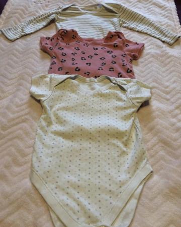 Image 1 of Set of three different coloured baby grows