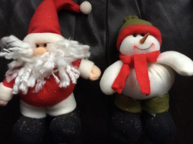 Preview of the first image of 3 small Christmas fabric soft plush ornaments.