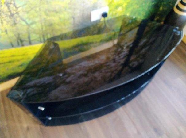 Image 1 of A 'Tech Link' black tempered glass corner TV unit
