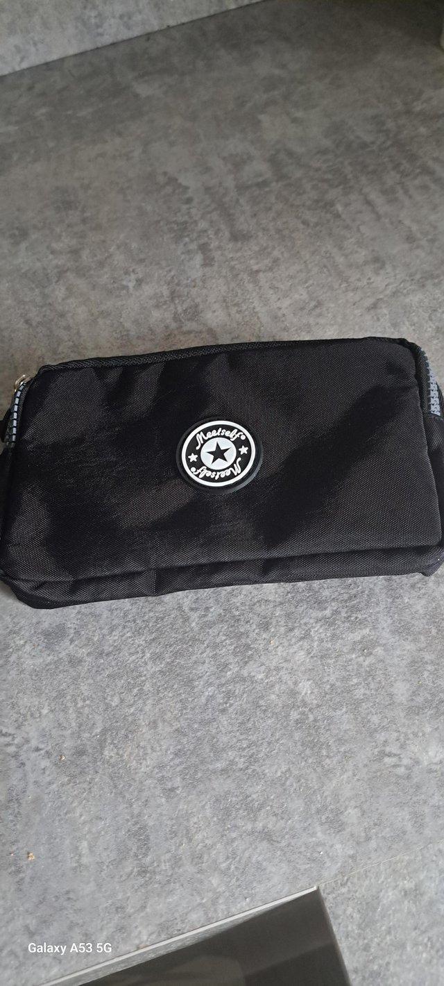 Preview of the first image of Coin purse with three zips fasten.
