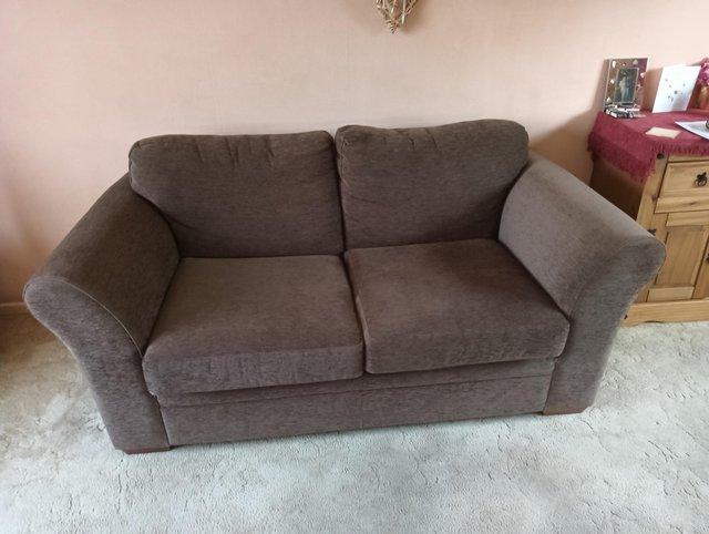 Preview of the first image of Sofa - chocolate coloured 2/3 seater.