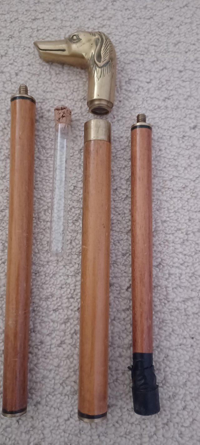 Preview of the first image of Collapsible Walking Stick with enclosed flask.