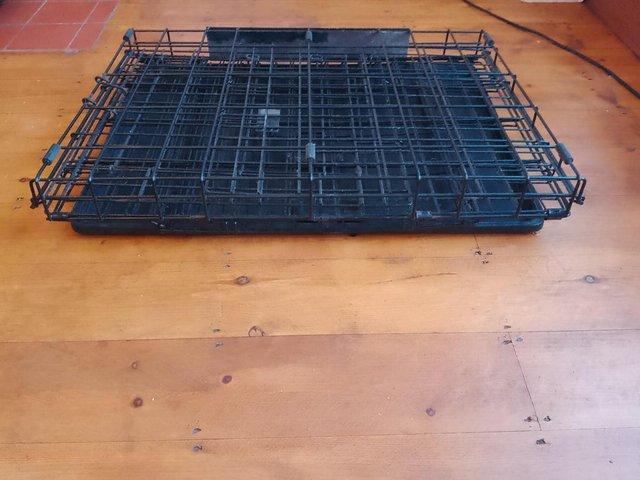 Preview of the first image of Folding Metal Dog Cage with base.