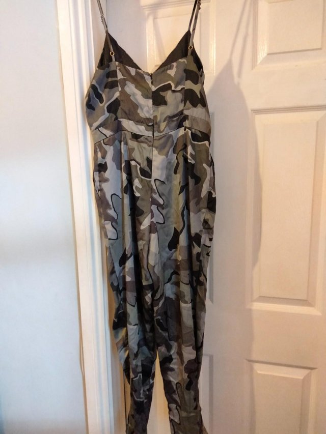 Preview of the first image of River Island Jumpsuit Size 12.