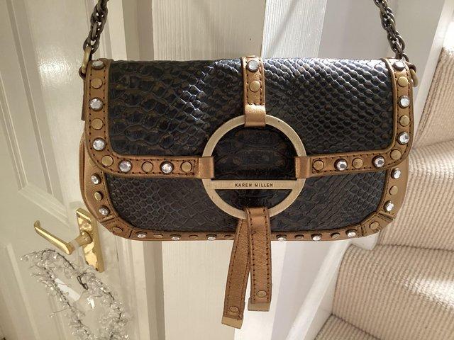 Preview of the first image of Karen Millen bronze leather bag.