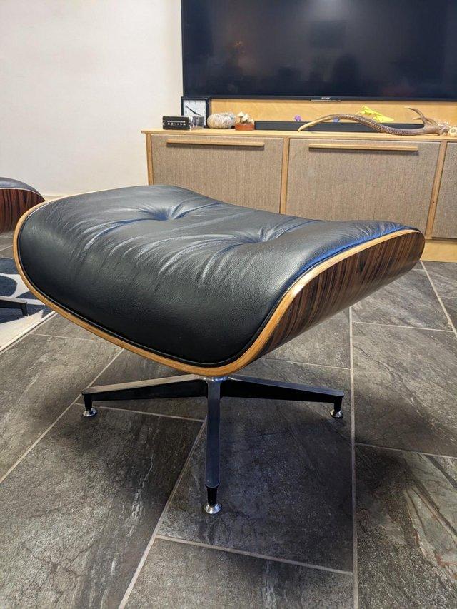 Preview of the first image of Eames ottoman circa 1980s, black leather.