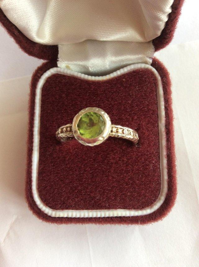 Preview of the first image of Pretty silver ring with green stone.