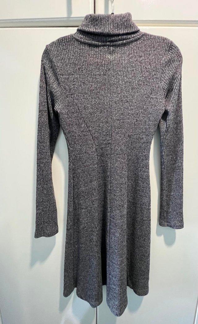 Preview of the first image of Dark grey turtle neck fit & flare dress size 6.