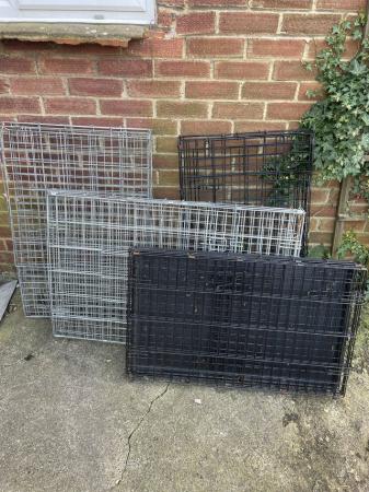 Image 1 of 2 L dog crates , 1 medium sized