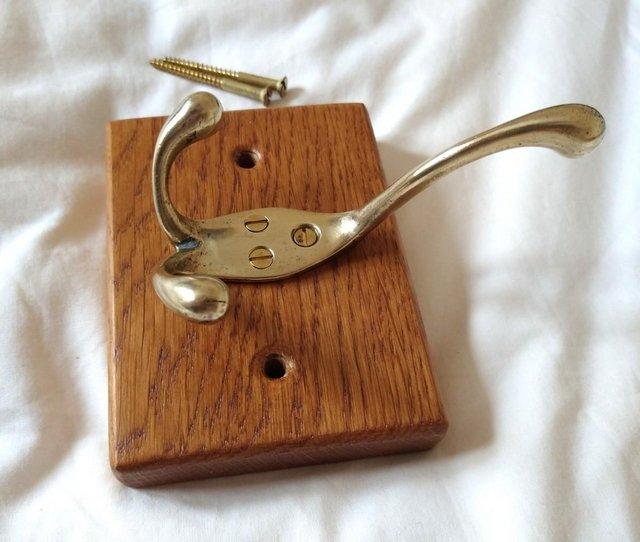 Preview of the first image of Brass hook on solid oak back plate - excellent condition.
